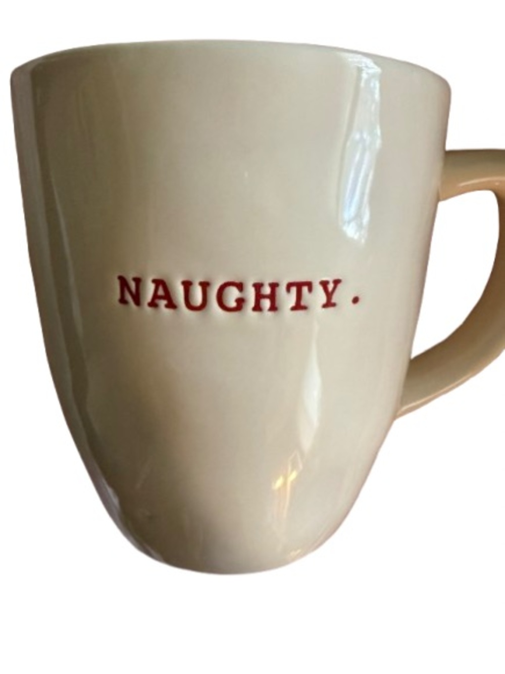 Rae Dunn holiday “naughty”mug with red script and interior.